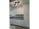 Well-lit kitchen featuring granite counters and white cabinets at 1945 Plantation Ln, Martinsville, IN 46151