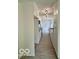 Kitchen with stainless steel appliances, white cabinets, granite counters, and tiled floors at 1945 Plantation Ln, Martinsville, IN 46151