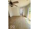 Living room with hardwood floors, modern lighting, and sliding doors leading to a deck at 1945 Plantation Ln, Martinsville, IN 46151