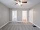 A spacious bedroom with neutral walls and carpet and two doorways at 204 N Vine St, Shelbyville, IN 46176