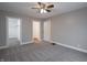 Bedroom featuring carpet, neutral walls and two doorways, one to a closet at 204 N Vine St, Shelbyville, IN 46176