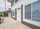 Exterior shot of a gray home's entrance with a bright white door and window trim at 204 N Vine St, Shelbyville, IN 46176