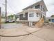 Rear exterior view of the home showing stone foundation at 204 N Vine St, Shelbyville, IN 46176