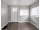 View of the main entryway, which includes a white door and hardwood floors at 204 N Vine St, Shelbyville, IN 46176