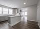 Kitchen view showcases the island and the fireplace in the living room at 204 N Vine St, Shelbyville, IN 46176