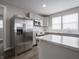 Charming kitchen featuring stainless refrigerator, and center island, ready for cooking and entertaining at 204 N Vine St, Shelbyville, IN 46176