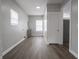A large mud room with hardwood flooring and built-in utility sink offers space and functionality at 204 N Vine St, Shelbyville, IN 46176