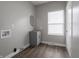 Bright and modern mud room features vinyl flooring, storage space, and utility hookups at 204 N Vine St, Shelbyville, IN 46176