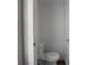Small powder room featuring a standard toilet and neutral paint at 204 N Vine St, Shelbyville, IN 46176