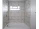 A close up of the white tile shower surround at 204 N Vine St, Shelbyville, IN 46176