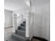 Traditional staircase with decorative wood banisters and hardwood floors at 204 N Vine St, Shelbyville, IN 46176