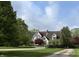 Traditional style home with manicured lawn, mature trees, and inviting curb appeal at 2090 Mulsanne Dr, Zionsville, IN 46077