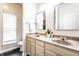 Bathroom featuring double sink vanities, modern mirrors, and great lighting at 2237 N New Jersey St, Indianapolis, IN 46205