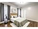 Serene bedroom with stylish decor, natural light, and hardwood floors at 2237 N New Jersey St, Indianapolis, IN 46205