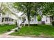 Charming single Gathering home with a welcoming curb appeal, a covered front porch and mature shade trees at 2237 N New Jersey St, Indianapolis, IN 46205