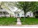 Charming single Gathering home with a welcoming curb appeal, a covered front porch and mature shade trees at 2237 N New Jersey St, Indianapolis, IN 46205