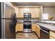 Bright kitchen featuring stainless steel appliances, gas range, and ample counter space at 2237 N New Jersey St, Indianapolis, IN 46205