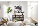 Bright living space with a decorative plant shelf, designer lighting, and a woven chair complete the inviting atmosphere at 2237 N New Jersey St, Indianapolis, IN 46205