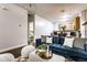Bright living room featuring modern furnishings and an open floor plan leading into the kitchen at 2237 N New Jersey St, Indianapolis, IN 46205