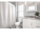 Bathroom with white vanity, shower with curtain, and clean finishes at 2251 N New Jersey St, Indianapolis, IN 46205