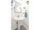 Bathroom features a pedestal sink, mirrored cabinet, and clean finishes at 2251 N New Jersey St, Indianapolis, IN 46205