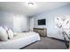 Comfortable bedroom with neutral tones, soft textures, and stylish furnishings at 2251 N New Jersey St, Indianapolis, IN 46205