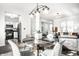 Bright dining area with a round table, seating for four, seamlessly connects to the kitchen and living area at 2251 N New Jersey St, Indianapolis, IN 46205