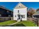 Charming two-story home with light gray siding, a welcoming front porch, and green lawn at 2251 N New Jersey St, Indianapolis, IN 46205