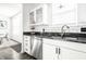 Bright kitchen features stainless steel appliances and white cabinets at 2251 N New Jersey St, Indianapolis, IN 46205