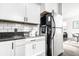 Bright kitchen with stainless steel refrigerator and modern cabinets at 2251 N New Jersey St, Indianapolis, IN 46205