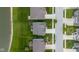 Drone shot of backyard of a home near a pond featuring a playground and covered patio enhancing the property at 2396 Creek Bank Dr, Columbus, IN 47201
