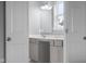 Modern bathroom with gray cabinets, double sinks, vanity and gray walls at 2396 Creek Bank Dr, Columbus, IN 47201