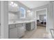 Bright bathroom with double vanity, gray cabinets, tile floors, and a separate shower at 2396 Creek Bank Dr, Columbus, IN 47201
