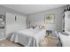Bedroom featuring neutral walls, a double-door closet, and a bed with white bedding at 2396 Creek Bank Dr, Columbus, IN 47201