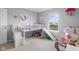 Bright bedroom with a bunk bed featuring a slide, complemented by views of the scenic pond at 2396 Creek Bank Dr, Columbus, IN 47201