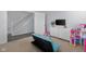 Comfortable bedroom featuring carpet floors and furniture, including a sofa and TV at 2396 Creek Bank Dr, Columbus, IN 47201