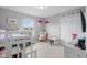 Charming bedroom with a whimsical unicorn theme, plush carpeting, and ample natural light from the window at 2396 Creek Bank Dr, Columbus, IN 47201