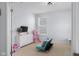 Bright bedroom with carpet floors and furniture, including a sofa and TV at 2396 Creek Bank Dr, Columbus, IN 47201