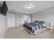 Cozy bedroom with a queen bed and a TV, adjacent to the bathroom and laundry area at 2396 Creek Bank Dr, Columbus, IN 47201