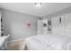 Bright bedroom showcasing neutral walls, closet and doorway to the landing at 2396 Creek Bank Dr, Columbus, IN 47201
