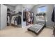 Walk-in closet with ample storage, shelving, and a treadmill for exercising at 2396 Creek Bank Dr, Columbus, IN 47201