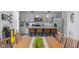 Dining area flows into the modern kitchen with granite counters and stainless appliances at 2396 Creek Bank Dr, Columbus, IN 47201