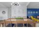 Open dining area features modern lighting and accent wall paint at 2396 Creek Bank Dr, Columbus, IN 47201