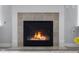 Inviting fireplace with tile surround and glass enclosure, creating a cozy focal point in the living area at 2396 Creek Bank Dr, Columbus, IN 47201