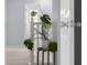 Bright hallway with a view of stairs and a decorative plant, adding a touch of nature at 2396 Creek Bank Dr, Columbus, IN 47201