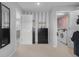 Hallway with black dresser leading to the bathroom, closet and laundry room at 2396 Creek Bank Dr, Columbus, IN 47201