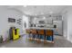 Kitchen boasts an island with barstool seating, granite counters, and stainless appliances at 2396 Creek Bank Dr, Columbus, IN 47201