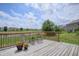 Open wood deck perfect for entertaining and relaxing with views of the water and backyard at 2449 Orchard Creek Dr, Columbus, IN 47201