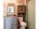 Bathroom with vanity, granite countertop, wooden shelving and shower at 2449 Orchard Creek Dr, Columbus, IN 47201