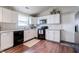 Bright kitchen featuring white cabinetry, granite countertops, and stainless steel appliances at 2449 Orchard Creek Dr, Columbus, IN 47201